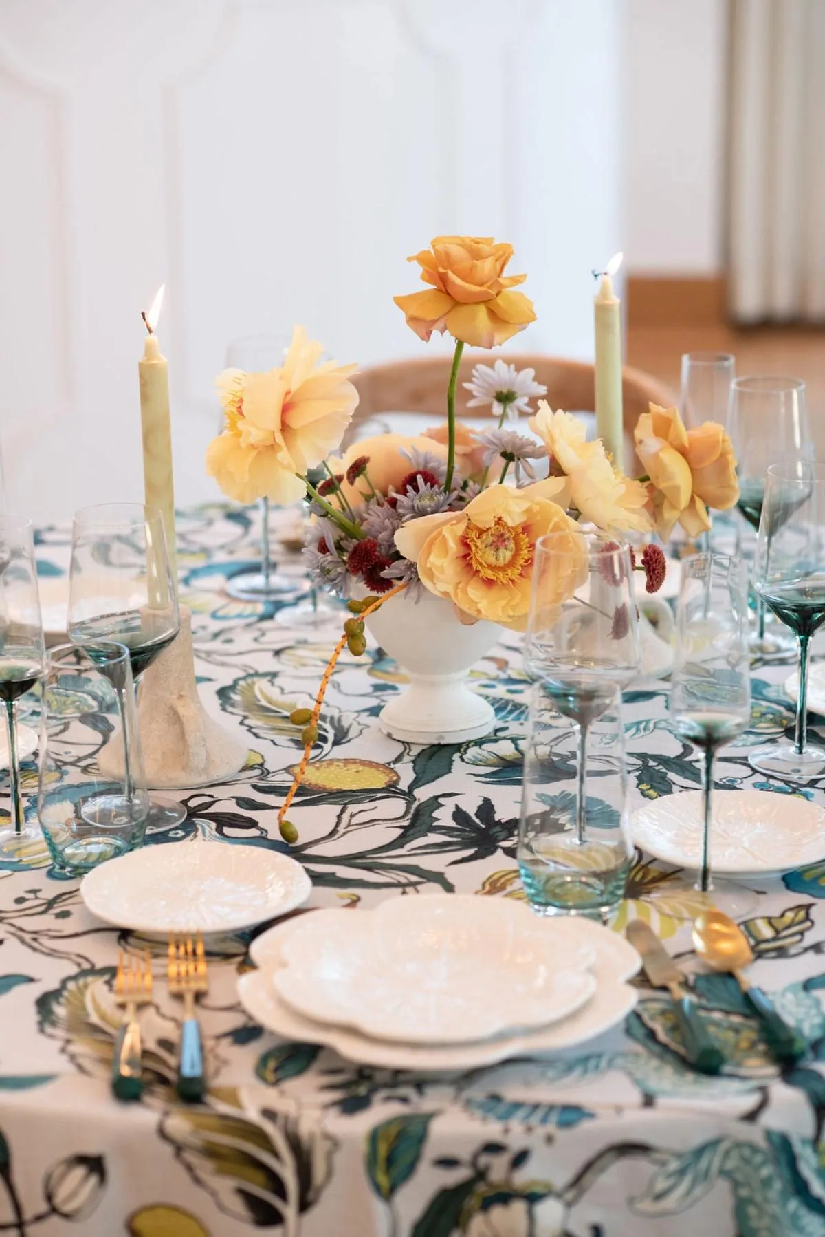 Wedding reception table styled with luxury linen rentals, floral centerpiece, and soft candlelight.