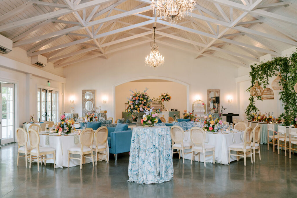 - Curated Linen Collection Round table covered with luxury linen fabric and floral centerpiece