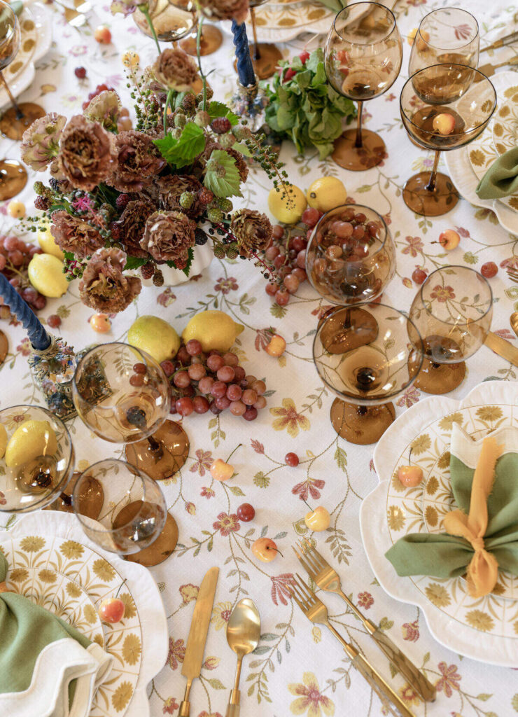 Elegant event table with textured linen fabric complementing rustic wood table