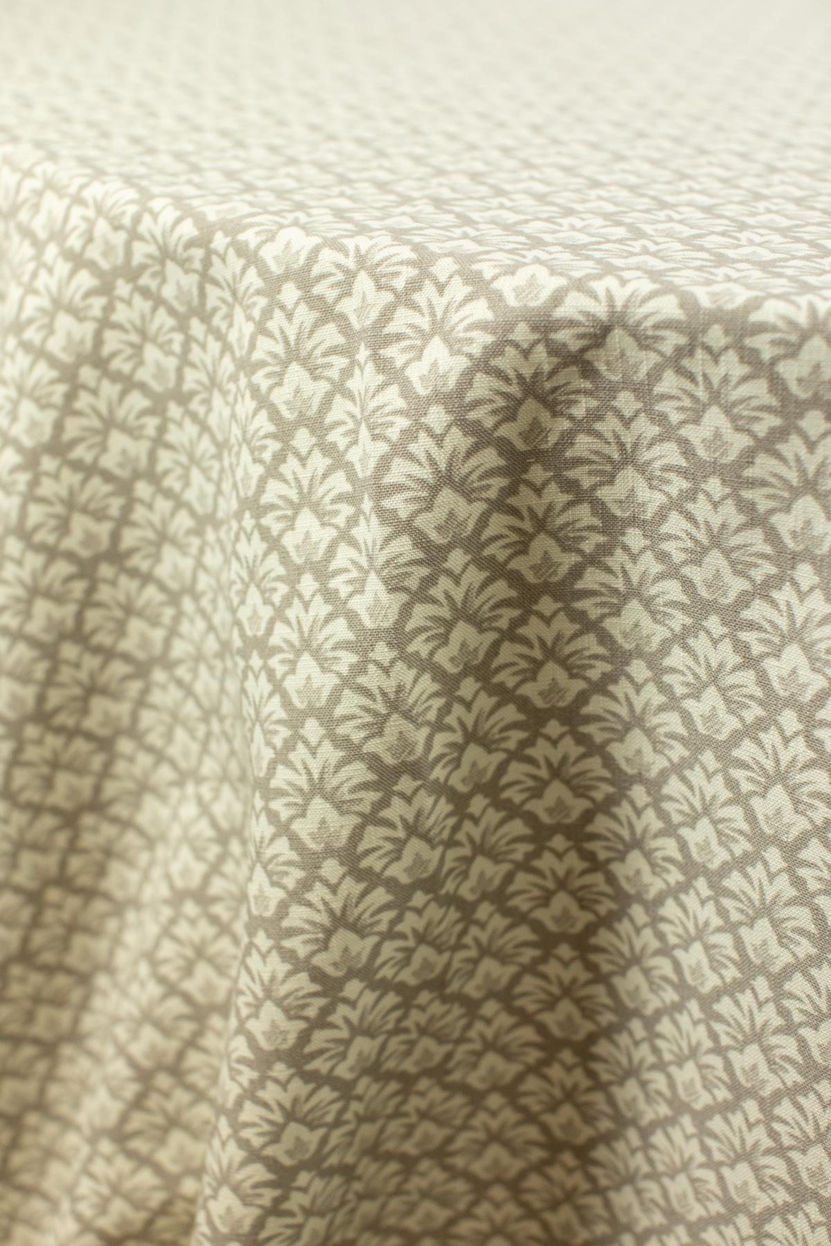 - Curated Linen Collection Low ceiling venue softened with lightweight draping and warm ambiance