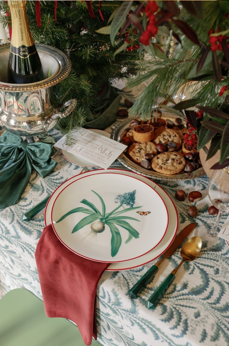 - Curated Linen Collection green and white table top linen with decor and cutlery setup