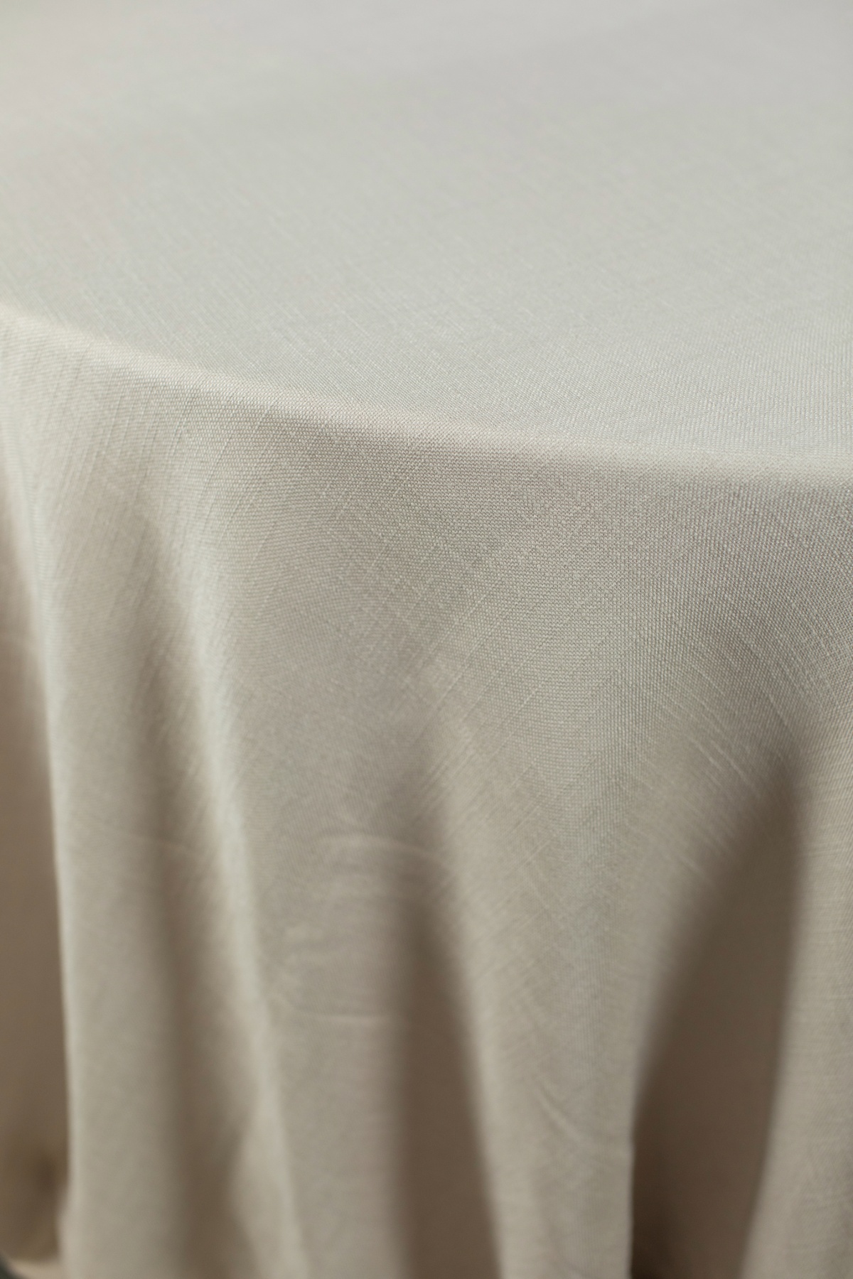 - Curated Linen Collection A luxurious beige table linen