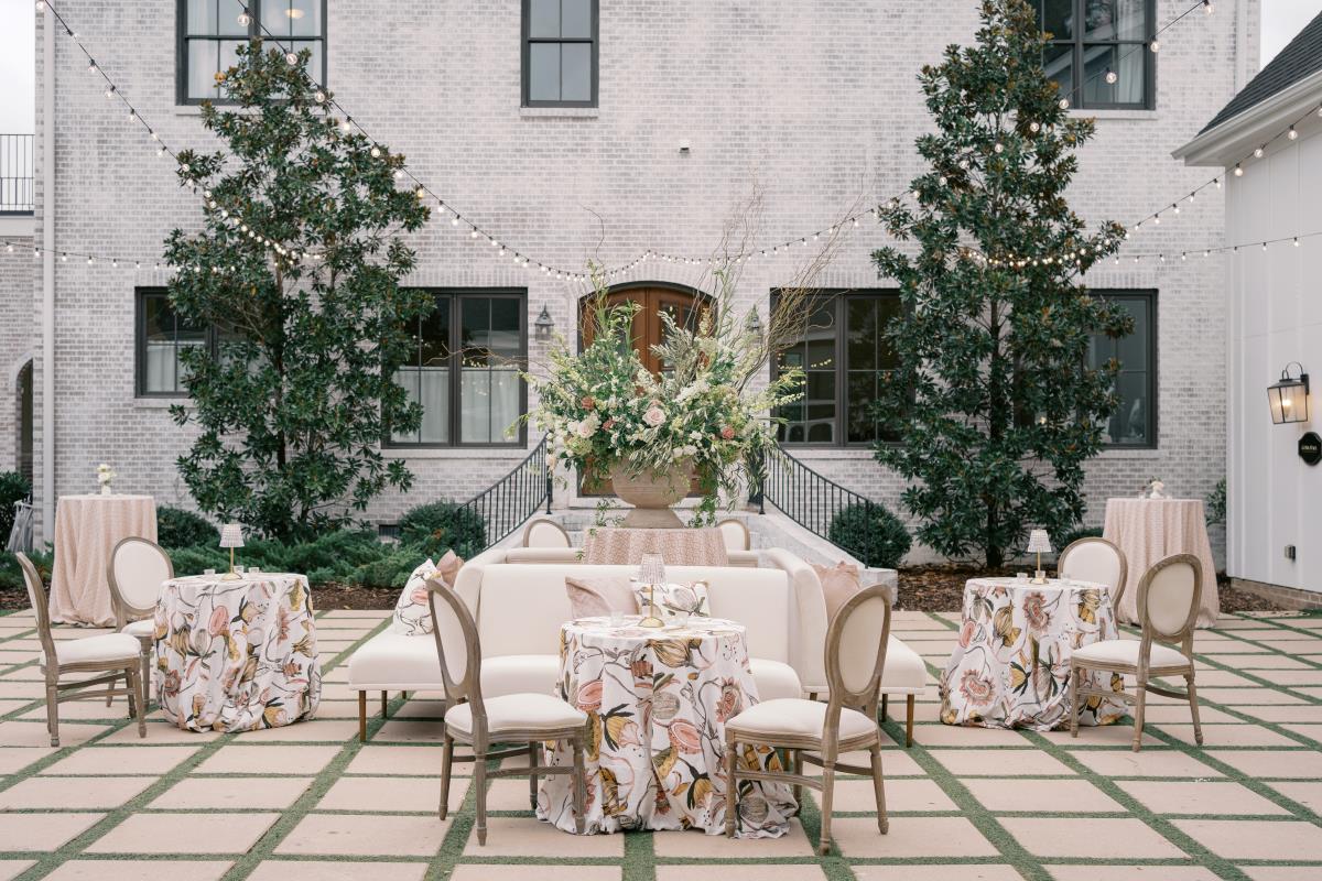 Romantic wedding aisle styled with layered luxury linen runners
