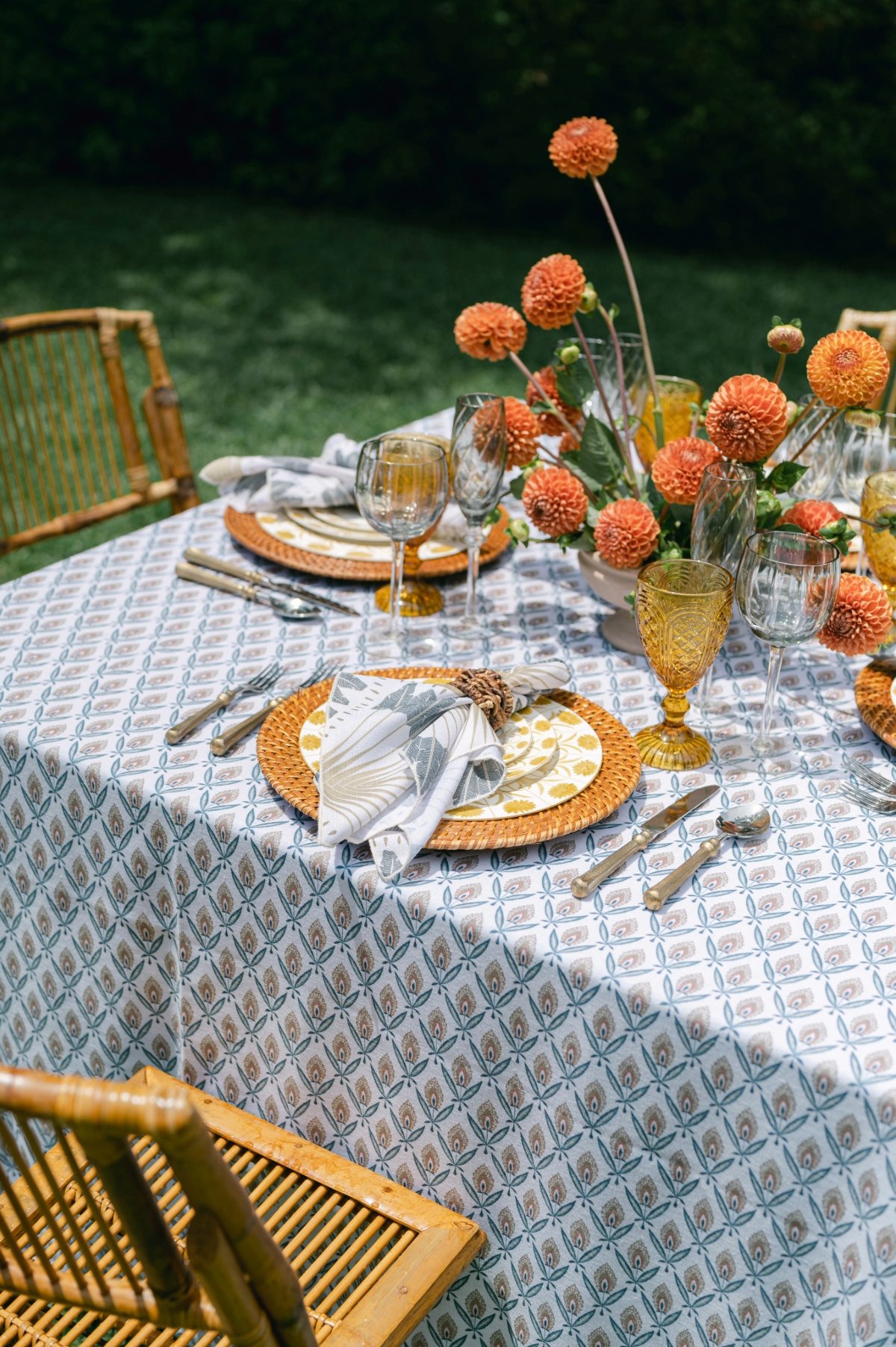 - Curated Linen Collection Wedding reception table with layered luxury linen fabrics and floral decor