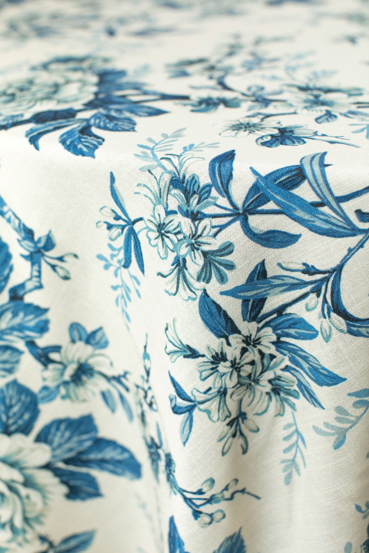 Premium stage draping and layered linens for upscale event focal point