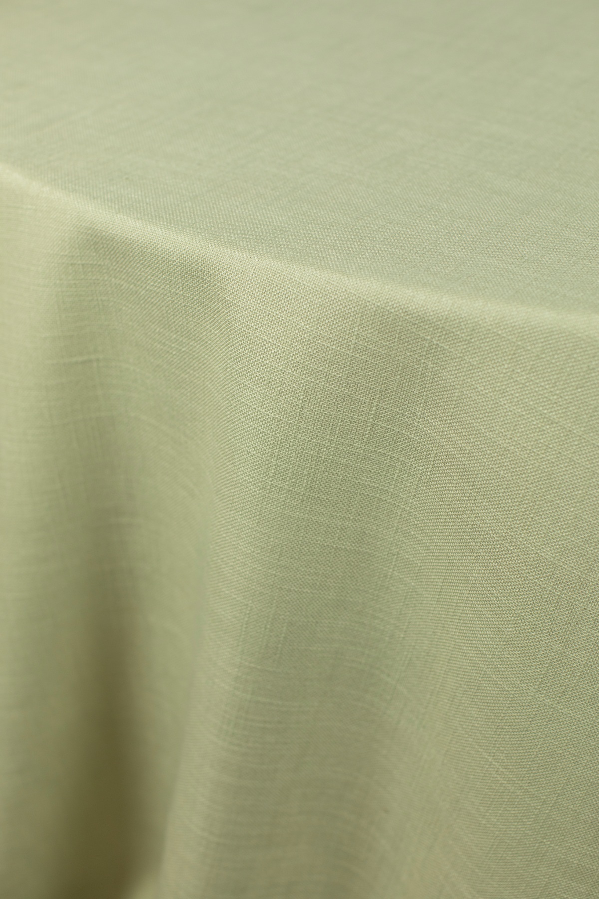 - Curated Linen Collection A luxurious green table linen