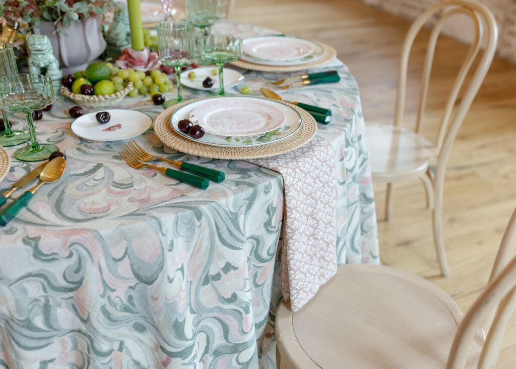 - Curated Linen Collection Luxury satin linens arranged for upscale gala dinner presentation