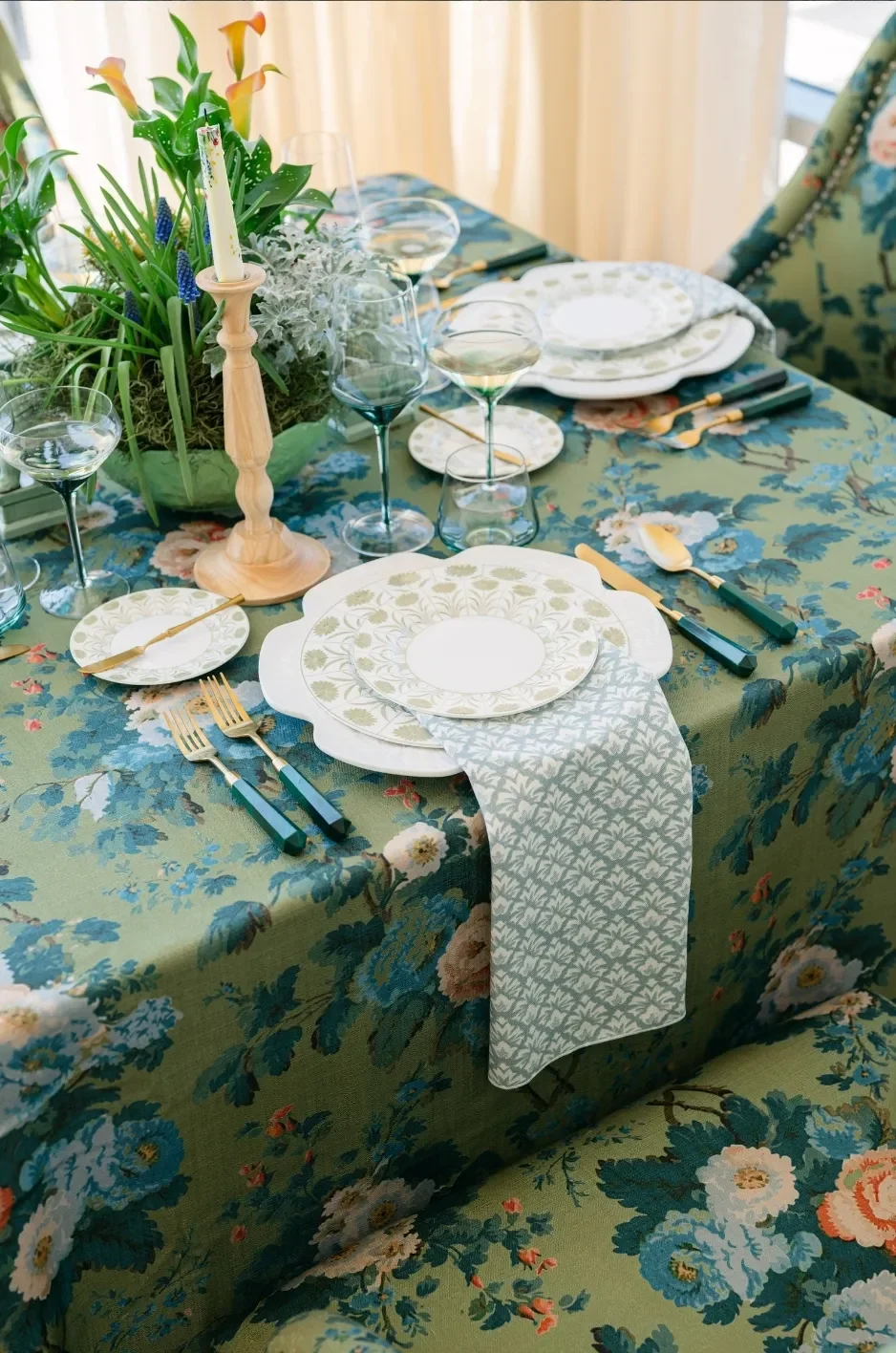 Patterned linens and floral arrangements on a wedding table showcasing coordinated textile design.