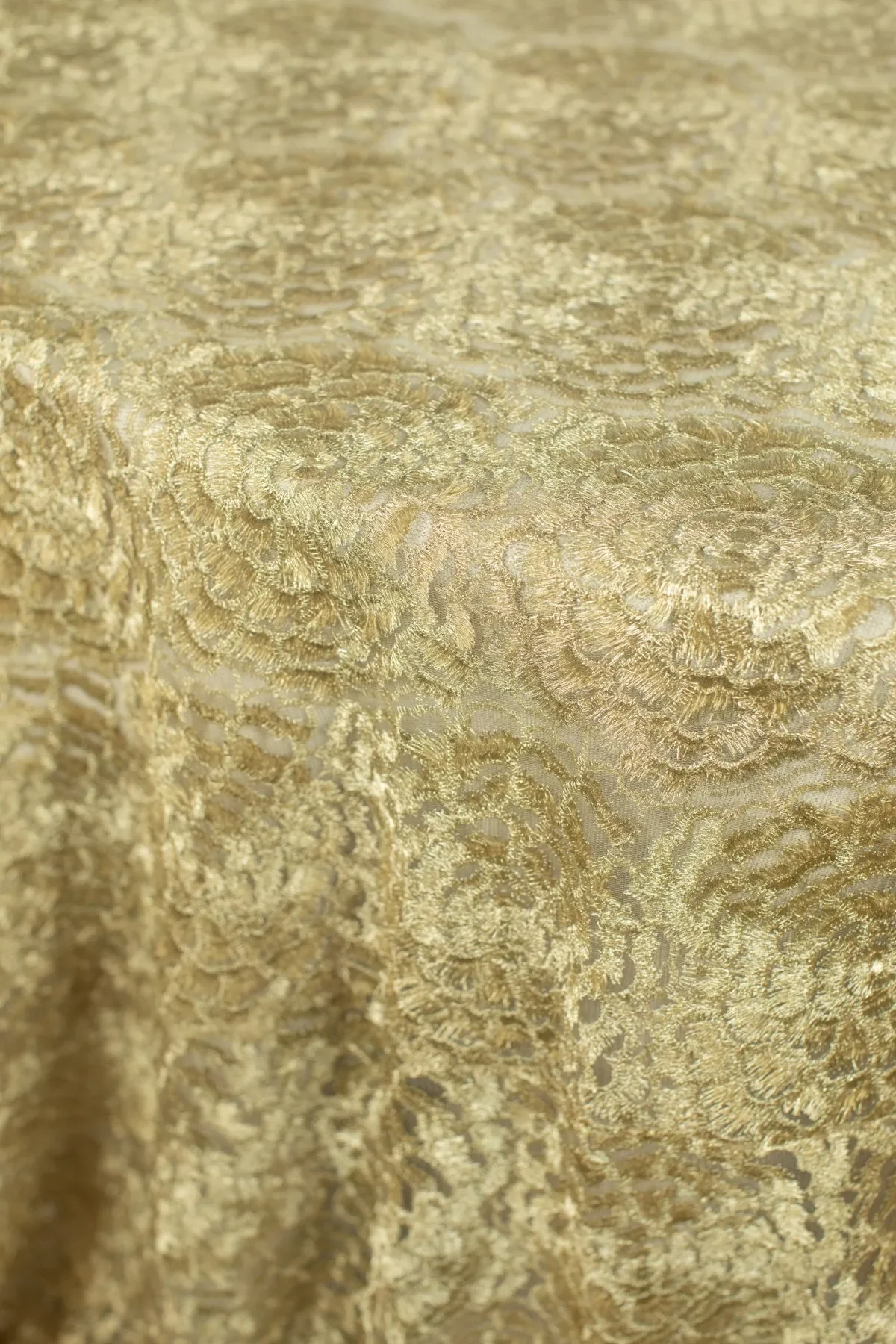 Gold lace overlay for wedding table linens and event decor